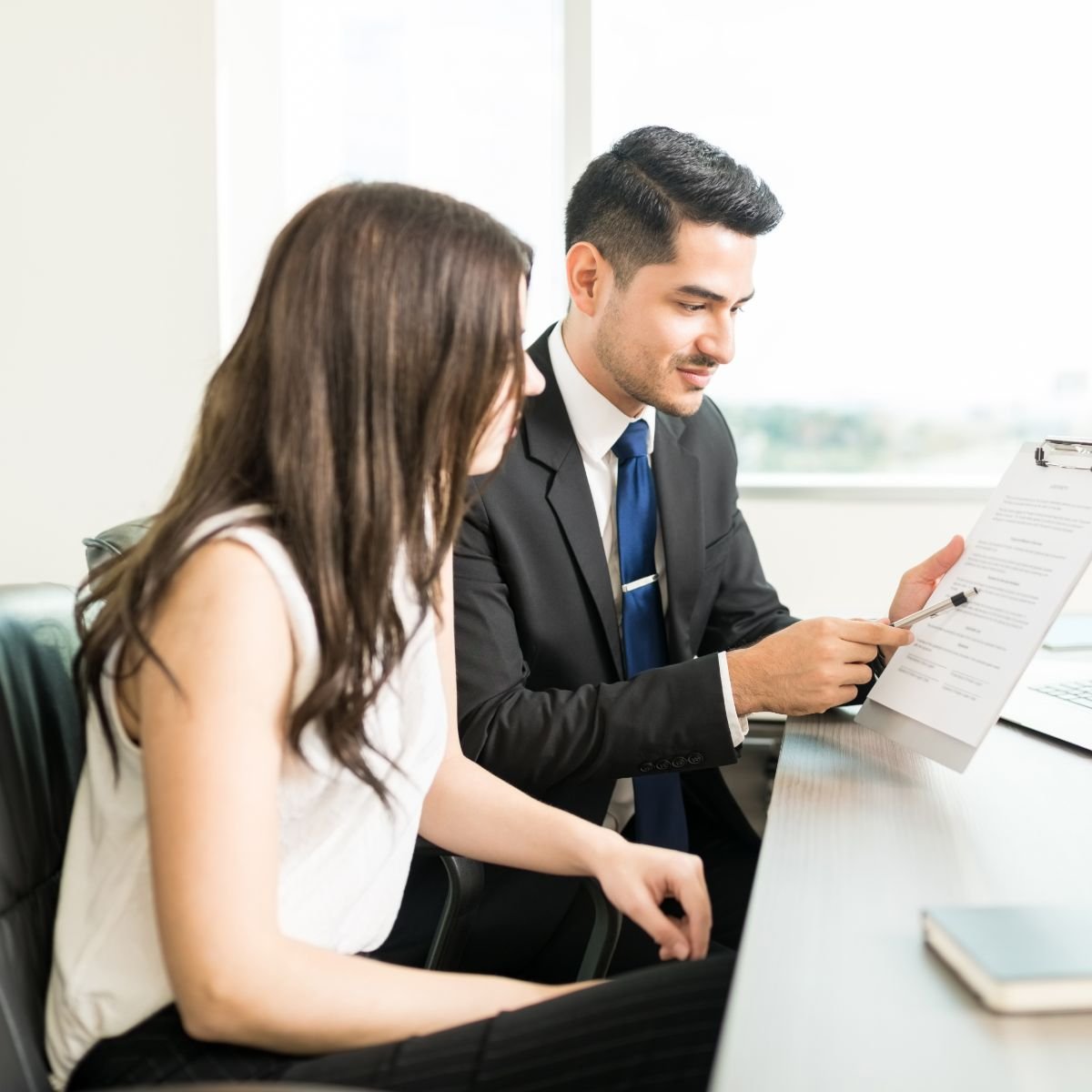 young-lawyer-attorney-reviewing-legal-document-meeting (1)